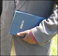 Swahili Union Version Bible in the hands of a pastor