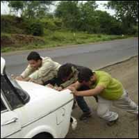 Pushing a car to get enough momentum to start it