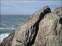 Photo: Rod Allday, 'Cleft in the rock known as High Place', CC BY-SA 2.0. Located below Towan Head, Cornwall, UK