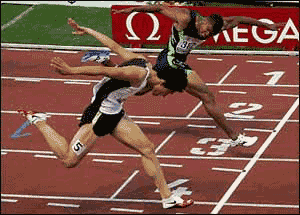 Xiang Liu of China 'dipping' forward to edge out competitor in 110-meter hurdles, 2005. Image: Reuters.